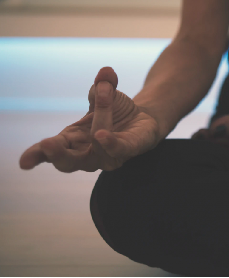 Image of the hand from a meditating woman