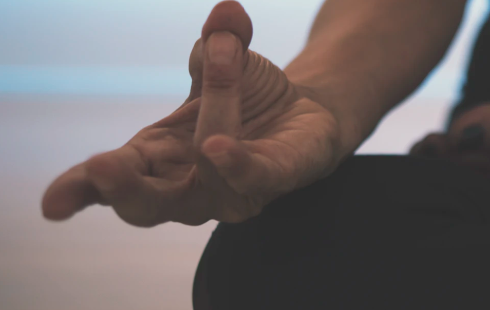 Image of the hand from a meditating woman